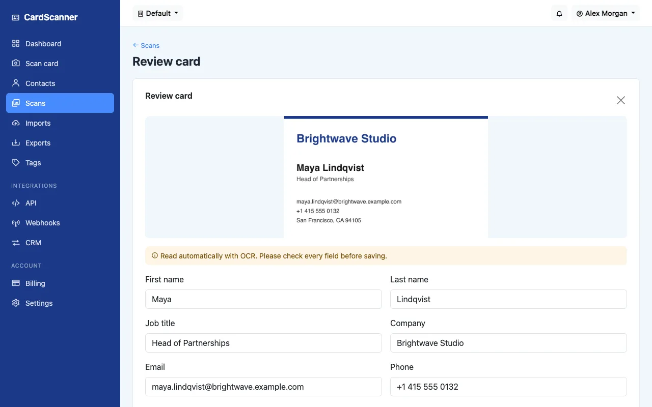 The CardScanner review screen showing a business card photo above the name, job title, company, email and phone read from it